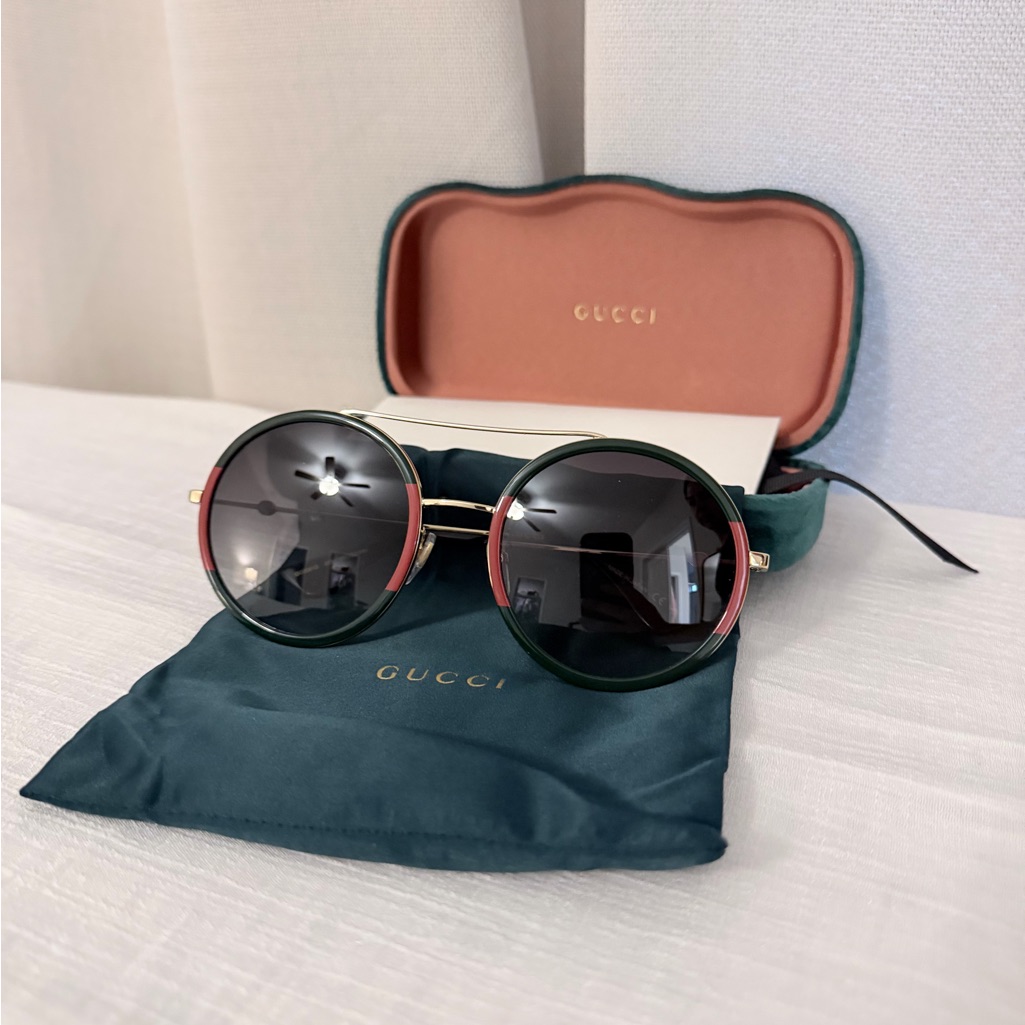Gucci Black And Gold Sunglasses With Pink Accents